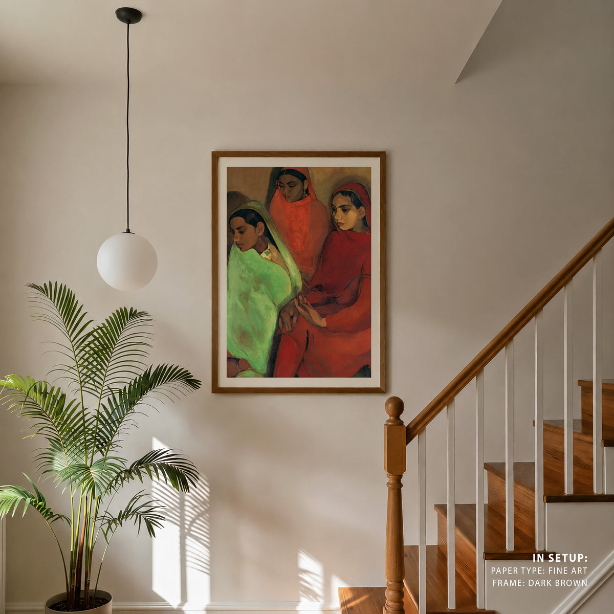 Framed artwork of three women in a home setting with a plant and staircase.